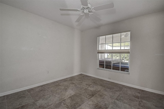 spare room with ceiling fan