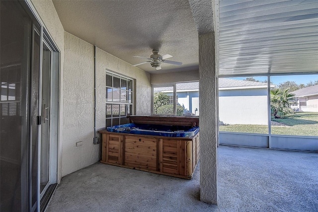 sunroom featuring ceiling fan