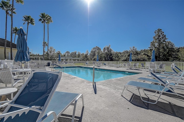 view of swimming pool with a patio