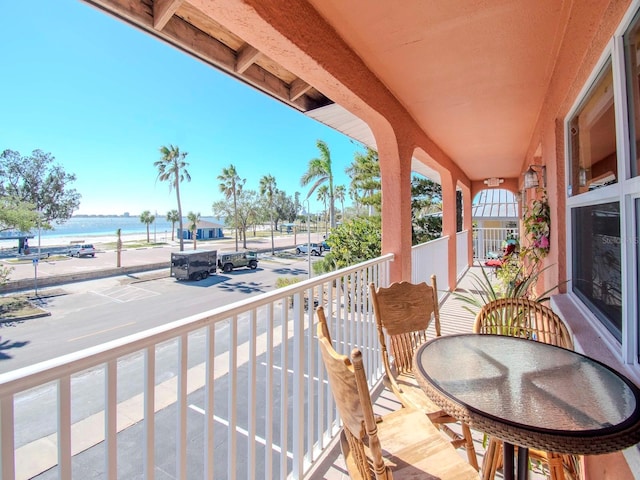 balcony featuring a water view