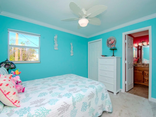 bedroom featuring ornamental molding, light carpet, ceiling fan, and ensuite bath