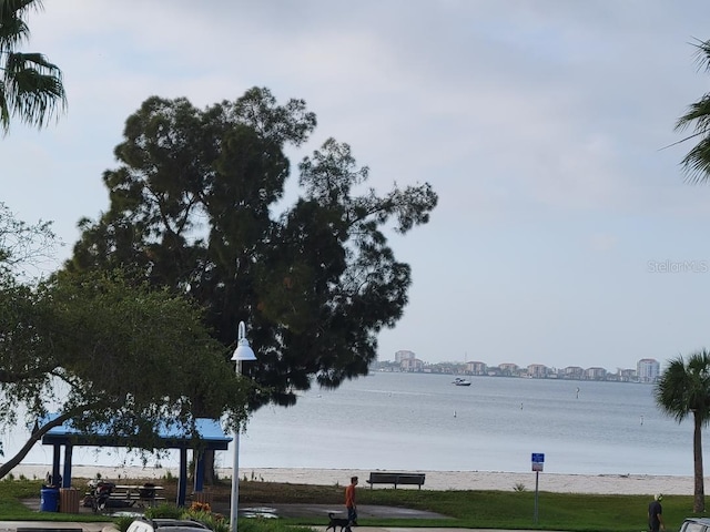 surrounding community with a water view and a gazebo