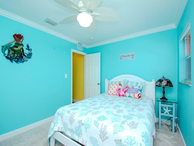 bedroom with crown molding, ceiling fan, and carpet floors