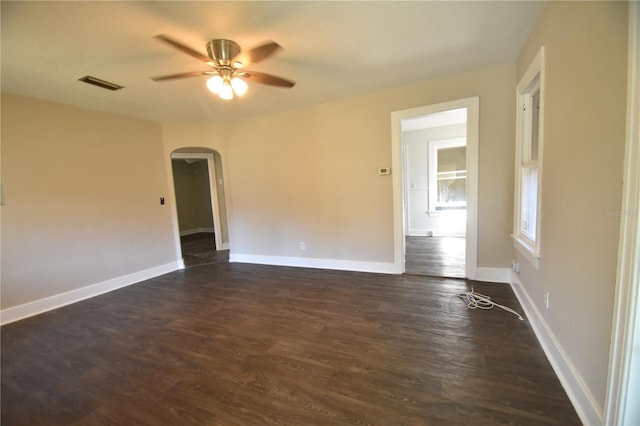 spare room featuring dark hardwood / wood-style floors and ceiling fan