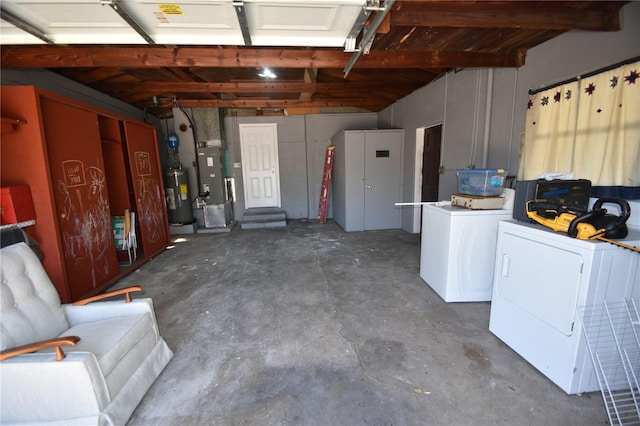 garage with separate washer and dryer and water heater