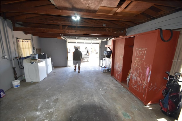 basement with washer and clothes dryer and a healthy amount of sunlight