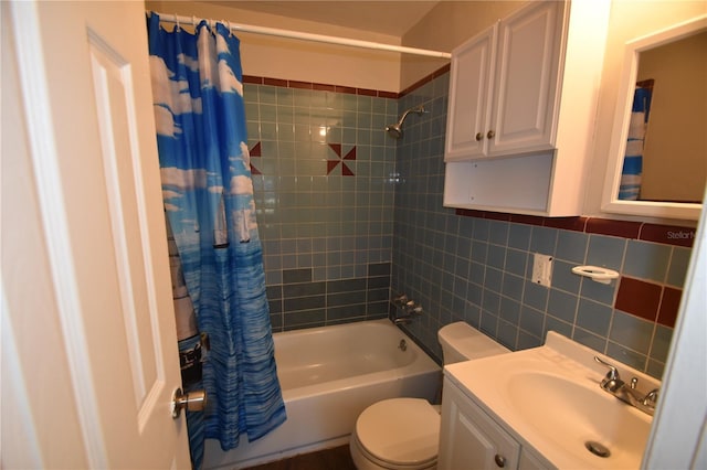 full bathroom featuring tile walls, vanity, shower / bath combo, and toilet