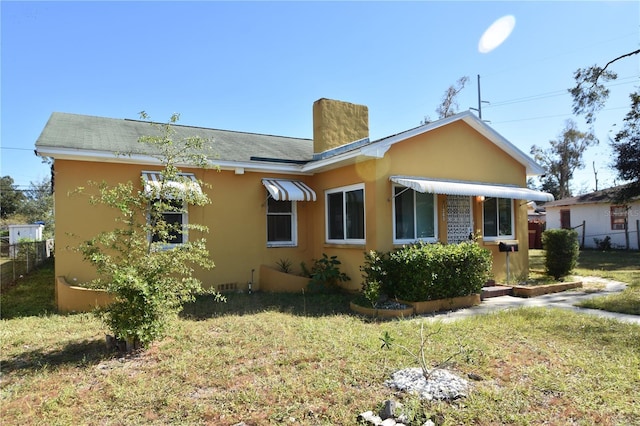 view of property exterior with a lawn