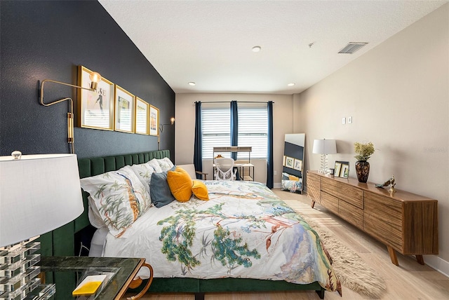 bedroom featuring light wood-type flooring