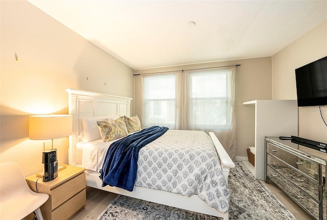 bedroom featuring dark wood-type flooring