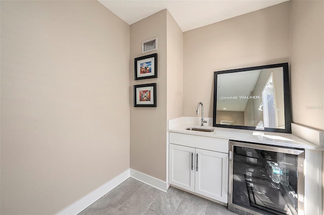 bathroom featuring vanity and wine cooler