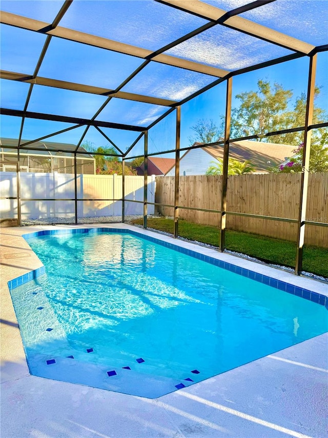 view of pool with a lanai