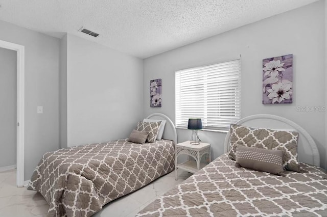 bedroom with a textured ceiling