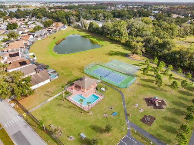 birds eye view of property with a water view