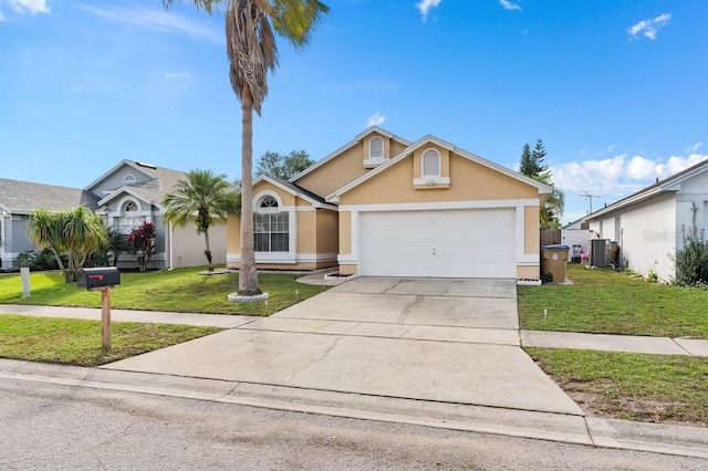 ranch-style house featuring central AC unit, a garage, and a front yard