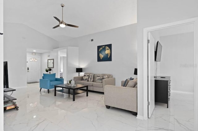 living room with ceiling fan and high vaulted ceiling