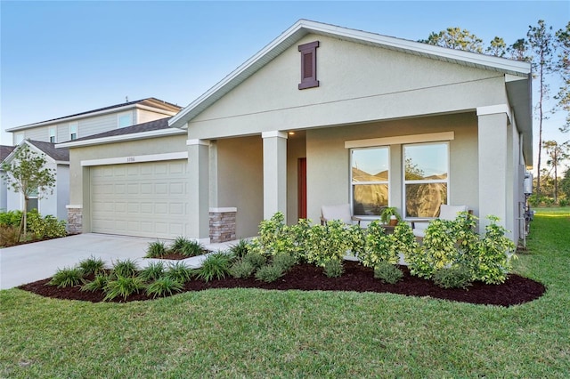 view of front of property featuring a garage and a front lawn