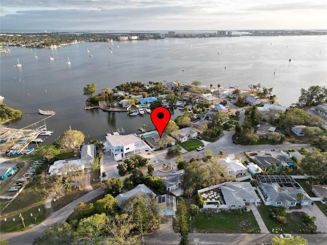 birds eye view of property featuring a water view and a residential view