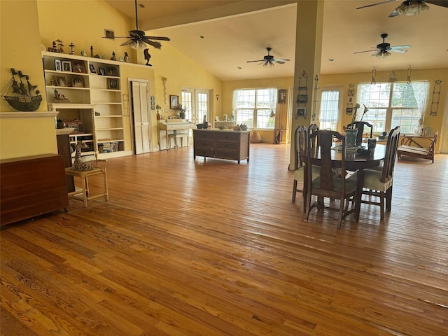 dining room featuring lofted ceiling, ceiling fan, and hardwood / wood-style floors