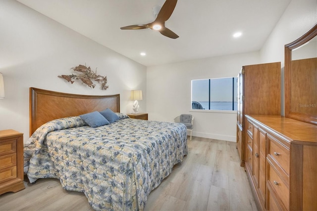 bedroom with light hardwood / wood-style floors and ceiling fan