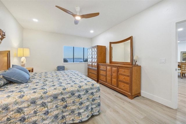 bedroom with ceiling fan and light hardwood / wood-style flooring