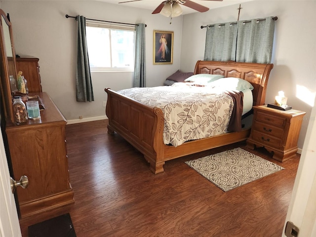 bedroom featuring dark hardwood / wood-style flooring and ceiling fan