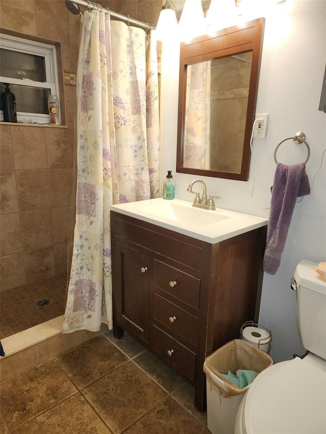 bathroom with tile patterned flooring, vanity, toilet, and a shower with shower curtain