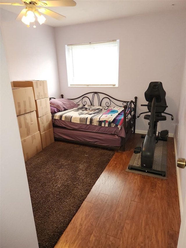 bedroom featuring hardwood / wood-style flooring and ceiling fan