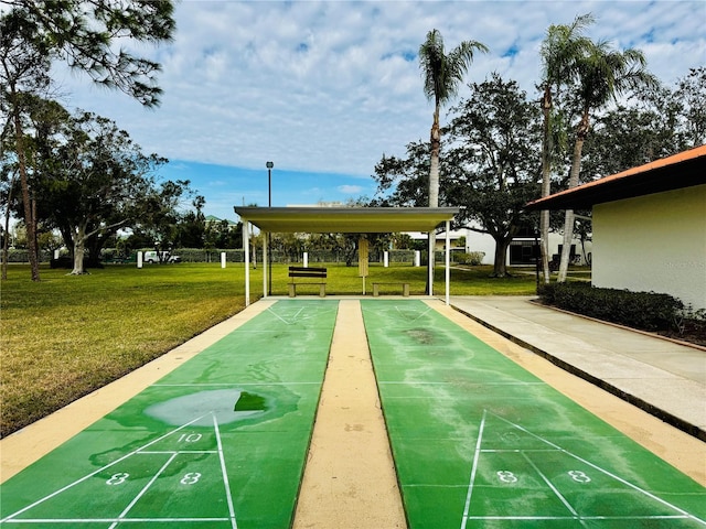 view of property's community with a lawn