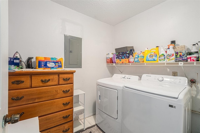 washroom featuring washer and clothes dryer, a textured ceiling, electric panel, and tile patterned floors