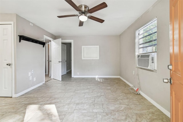 unfurnished bedroom with ceiling fan and cooling unit