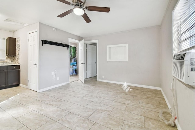 unfurnished room with ceiling fan, cooling unit, and crown molding