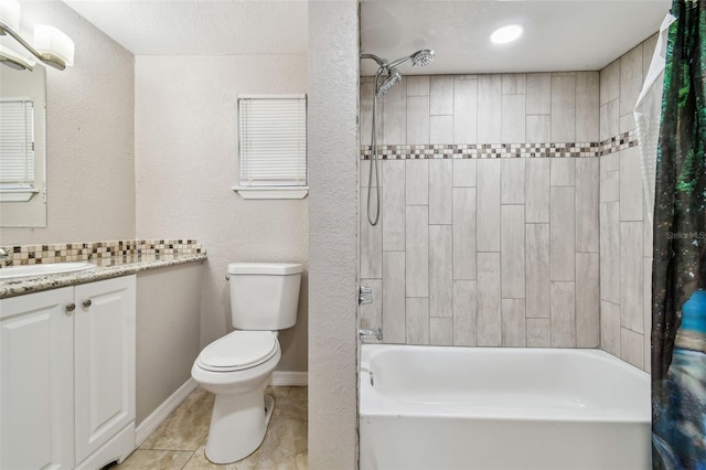 full bathroom featuring tile patterned floors, vanity, toilet, and shower / tub combo with curtain