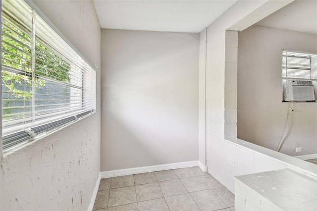 interior space featuring cooling unit and light tile patterned flooring