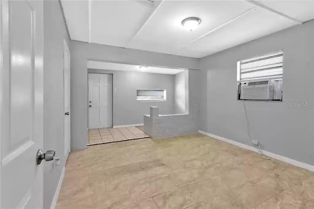 unfurnished room featuring cooling unit