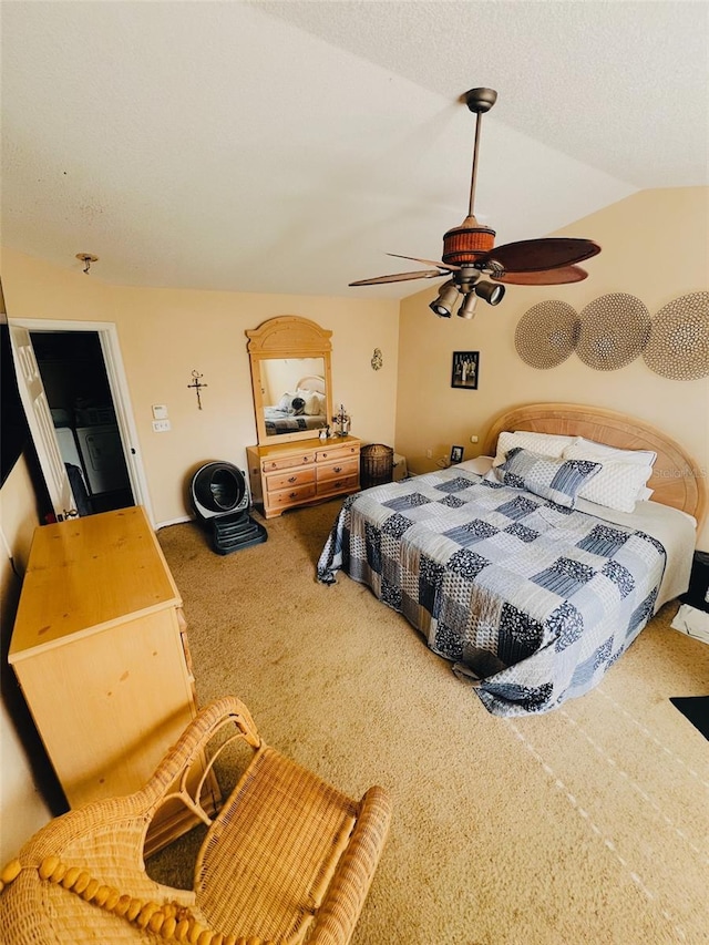 bedroom featuring lofted ceiling, a textured ceiling, ceiling fan, and carpet