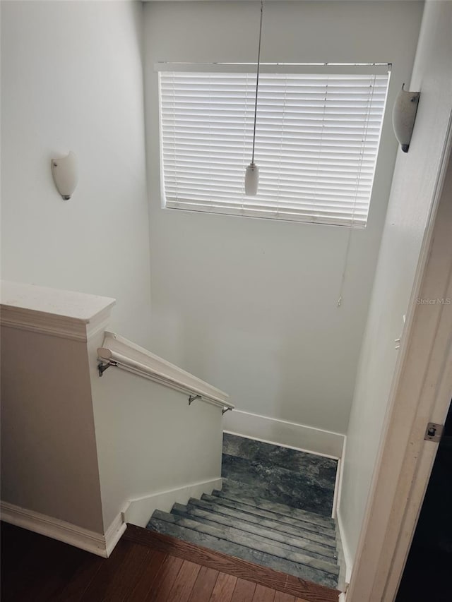 staircase featuring hardwood / wood-style flooring