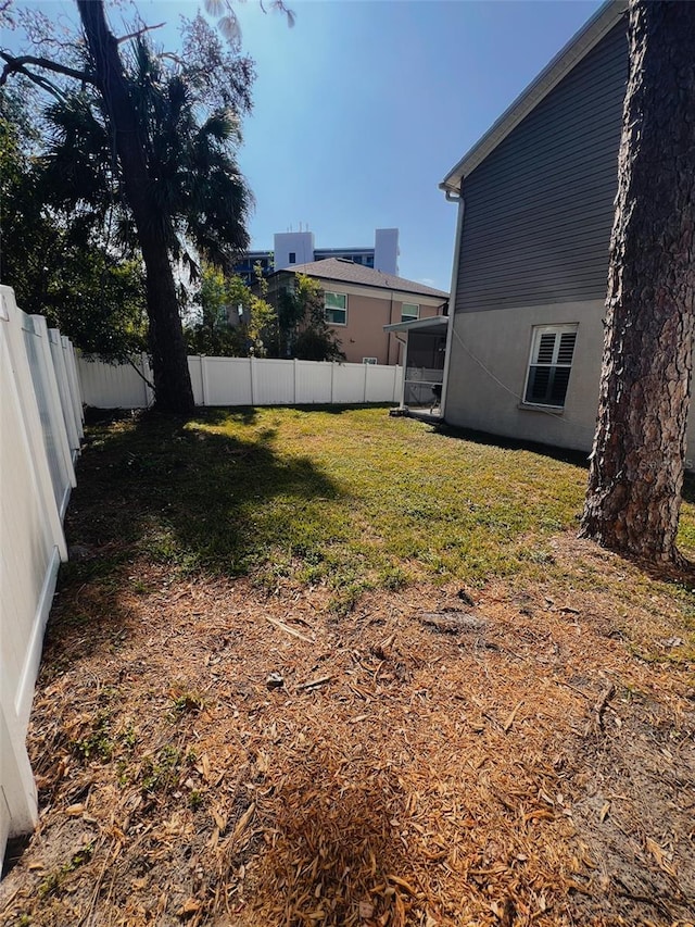 view of yard with a fenced backyard