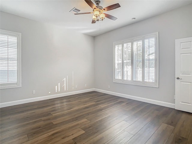 unfurnished room featuring ceiling fan and dark wood-type flooring