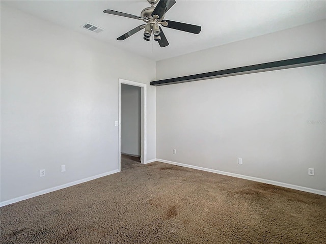 unfurnished room with ceiling fan and carpet floors