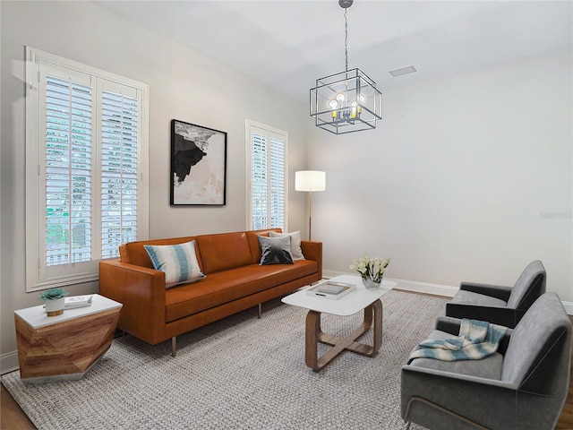 living room with a notable chandelier