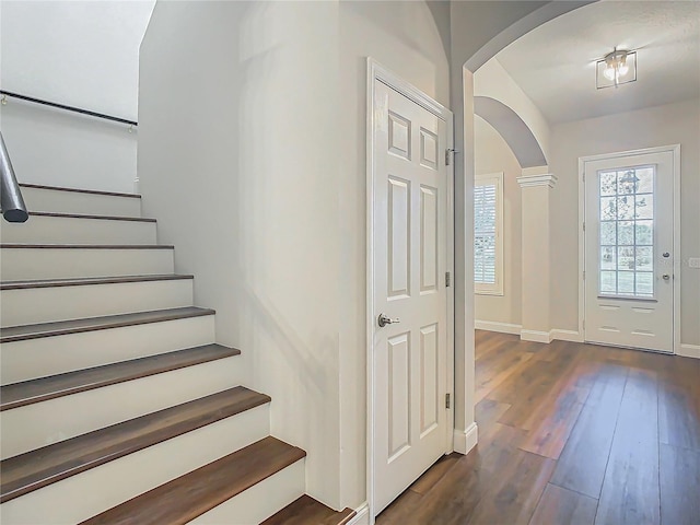 entrance foyer featuring dark wood-type flooring