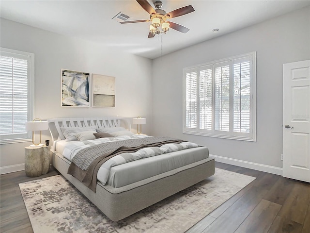 bedroom featuring ceiling fan and dark hardwood / wood-style flooring