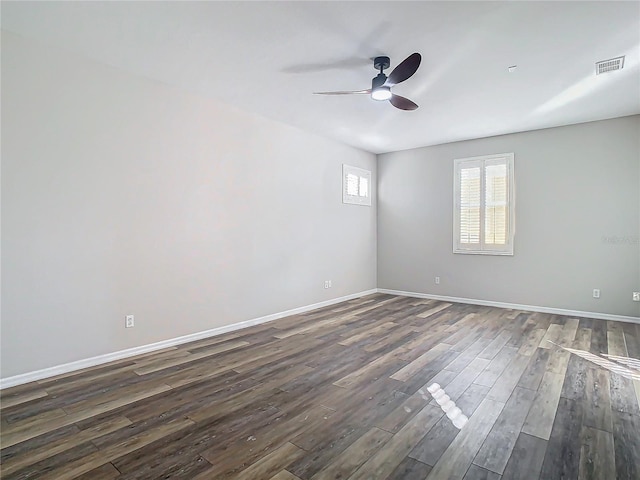 unfurnished room with dark hardwood / wood-style floors and ceiling fan