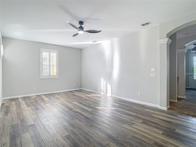 spare room with ceiling fan and dark hardwood / wood-style floors