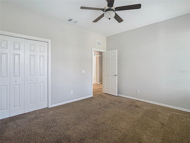 unfurnished bedroom featuring carpet floors, a closet, and ceiling fan