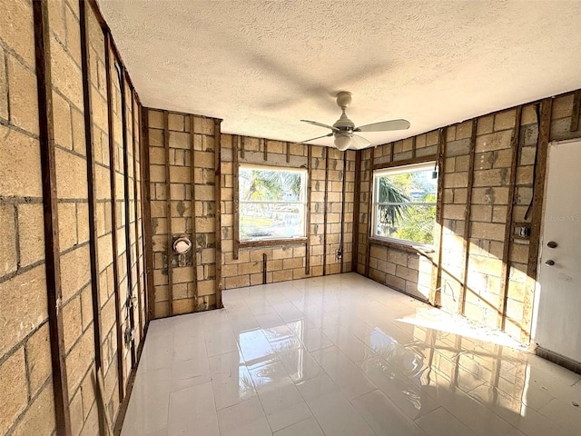 interior space featuring ceiling fan