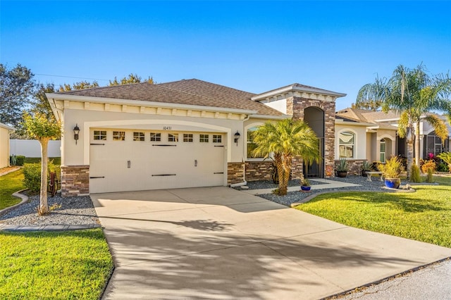 view of front of property with a front lawn and a garage