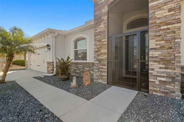 view of exterior entry featuring a garage