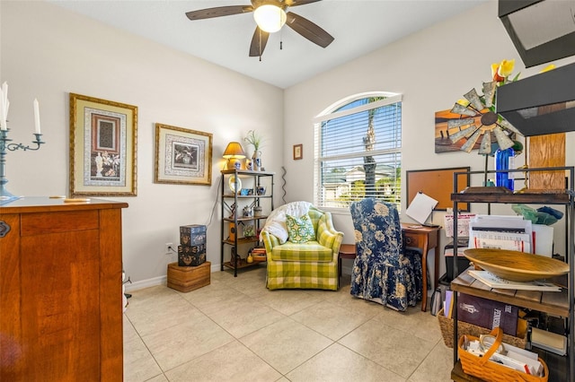 sitting room with ceiling fan and light tile patterned floors